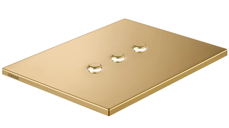 The Vimar Tondo light switch featuring a 3 gang option with gold face cover.